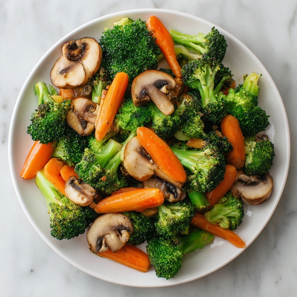 A white plate holds a colorful vegetable stir-fry arranged in an inviting mix. The base layer shows bright green broccoli florets with a firm texture, evenly spread. Interspersed among the broccoli are light brown, soft-looking mushroom slices placed on top and around. Bright orange carrot sticks are scattered throughout, adding a crunchy and fresh look. The dish has a slight glossy shine indicating a light sauce coating, all set on a white marbled background. photo taken with an iphone --ar 4:5 --v 7