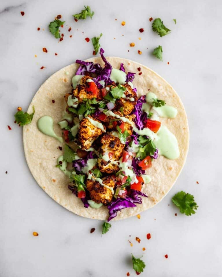 Vegan Roasted Cauliflower Tacos with Cilantro Lime Crema and Cabbage Slaw Recipe