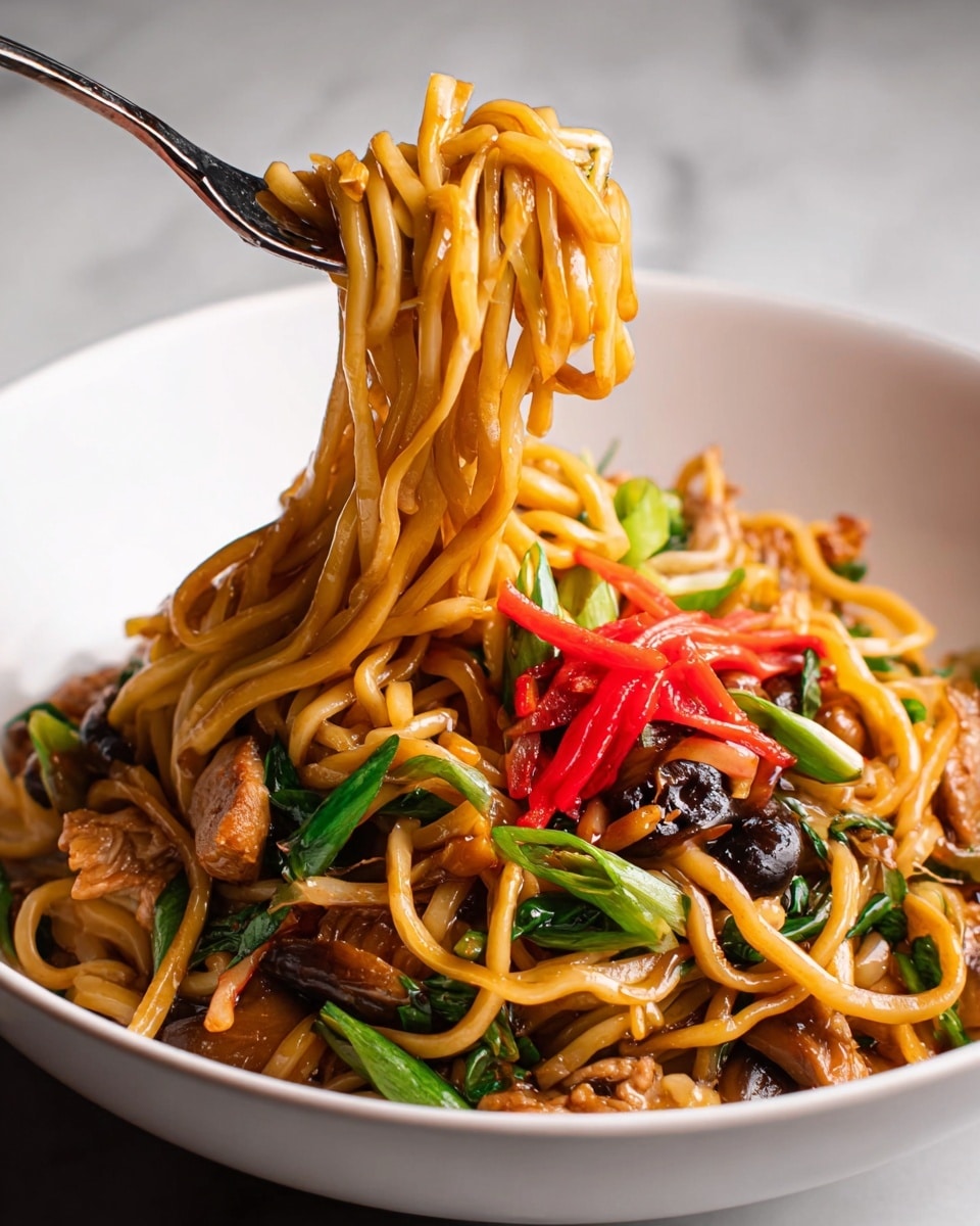 A white bowl filled with stir-fried noodles that have a shiny, slightly oily texture, mixed with chunks of brown meat, light yellow cabbage pieces, and green vegetable strips. Bright red thin strips are scattered on top, adding a pop of color. A silver fork is placed on the left side of the bowl, with noodles slightly wrapped around its tines. The bowl is set against a white marbled surface. photo taken with an iphone --ar 4:5 --v 7