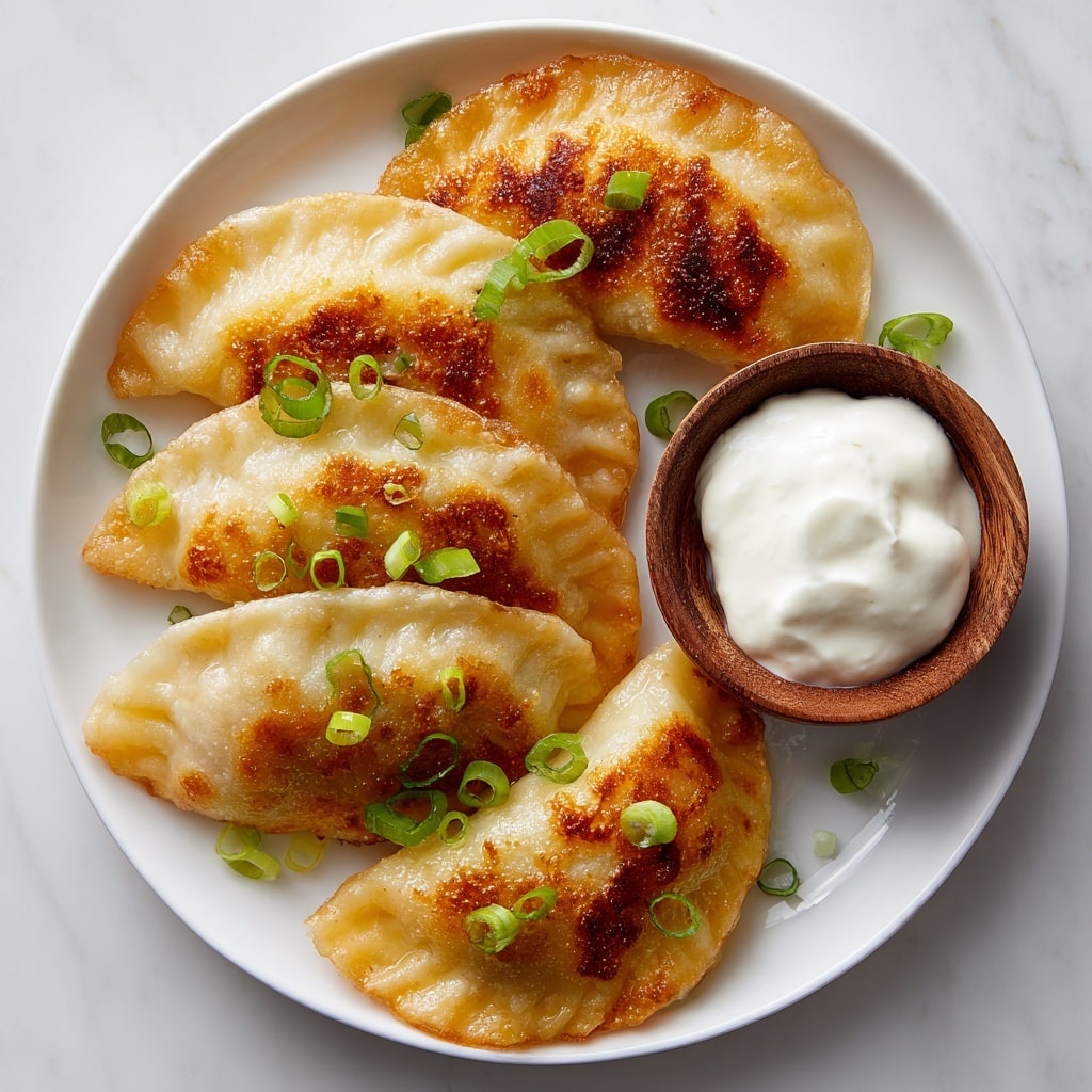 A close-up of a fried dumpling held by metal chopsticks, showing one side golden brown and crispy while the rest is soft and pale. The dumpling is broken open at one end, revealing a textured, soft, yellow-orange filling inside, indicating a rich or cheesy interior. The background features a white marbled texture with a blurred plate or surface underneath. Photo taken with an iphone --ar 4:5 --v 7