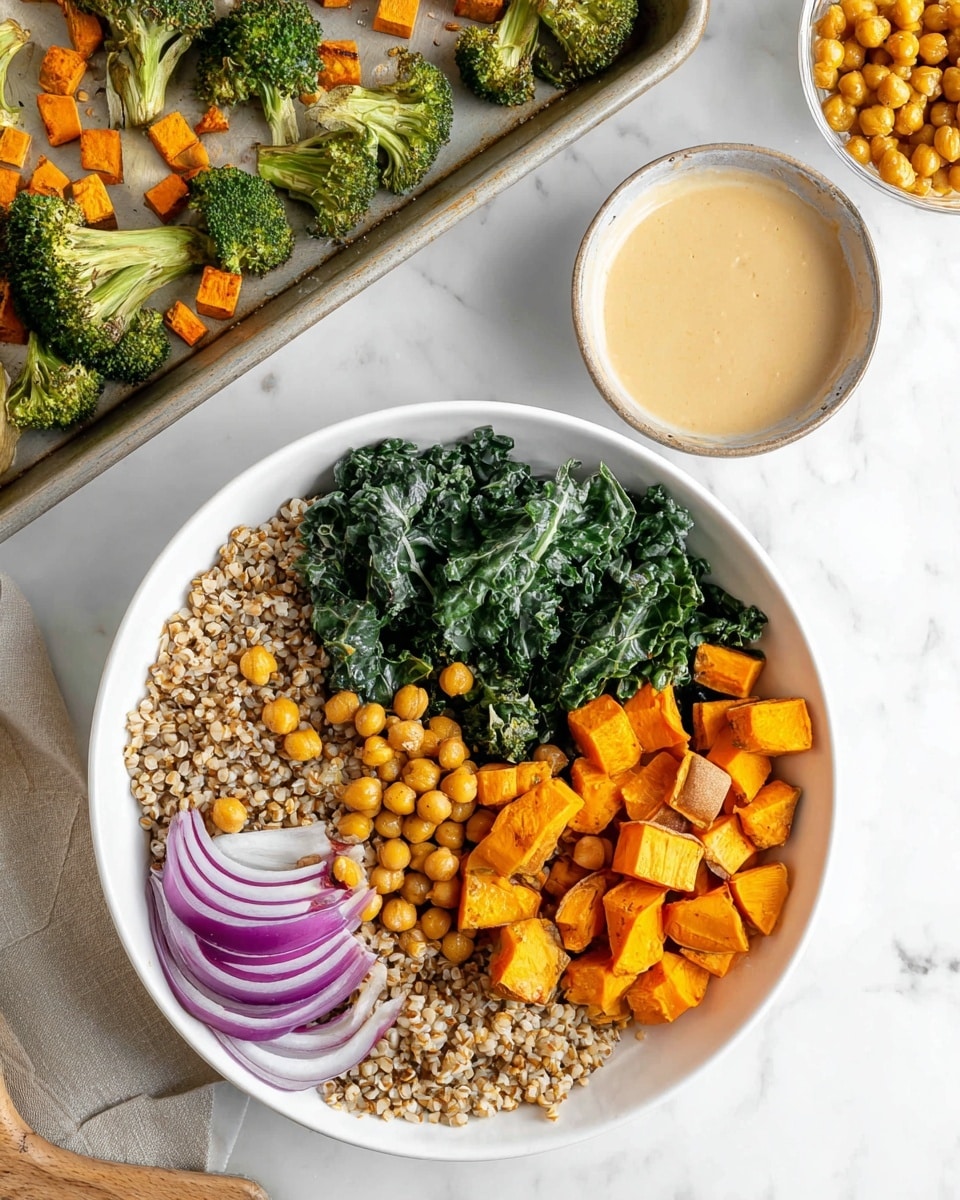 A white bowl shows four main layers arranged separately: the bottom layer is light brown cooked grains with a slightly rough texture, partially covered by dark green cooked kale with wrinkled leaves in the middle; to the right are bright orange roasted sweet potato cubes with a soft texture; below them is a single wedge of cooked purple onion with a juicy, smooth look; and to the left are small, round golden chickpeas with a slightly shiny surface. Next to the bowl, there is a small round bowl with a creamy beige sauce, and a baking tray in the background holds more roasted broccoli florets, sweet potato cubes, and chickpeas. The scene is set on a white marbled surface. Photo taken with an iphone --ar 4:5 --v 7