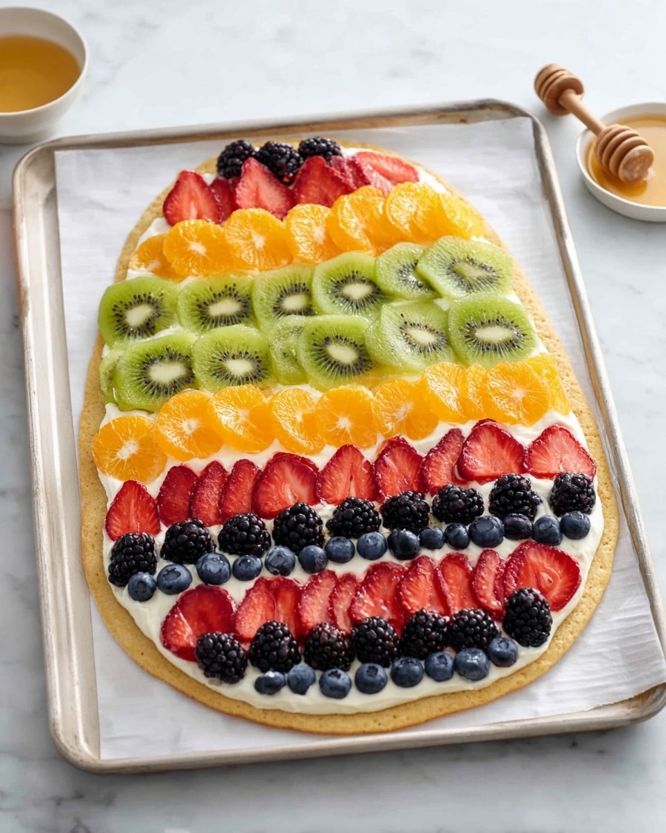 The image shows an Easter egg-shaped dessert with a smooth white base layer on a white marbled surface. The egg has five colorful horizontal fruit layers starting from the top: light green slices of kiwi, followed by a thin layer of small orange segments, then a line of bright red strawberry halves, a line of dark blackberries, another line of orange slices, a second line of green kiwi slices, another line with mixed half strawberries and blackberries, and finally another bottom line of kiwi slices. The fruits are neatly arranged in rows, creating a vibrant and fresh look. photo taken with an iphone --ar 4:5 --v 7